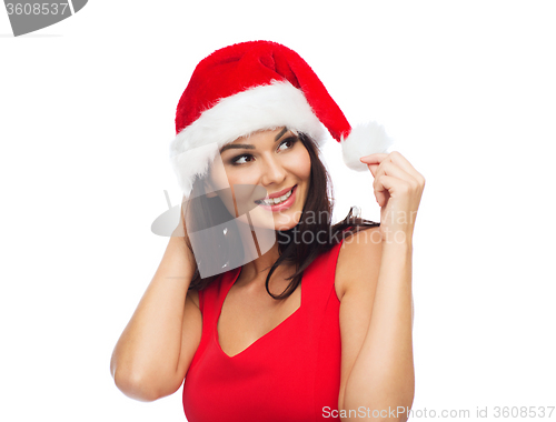 Image of beautiful sexy woman in santa hat and red dress