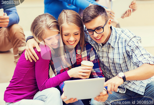 Image of group of students with tablet pc and coffee cup