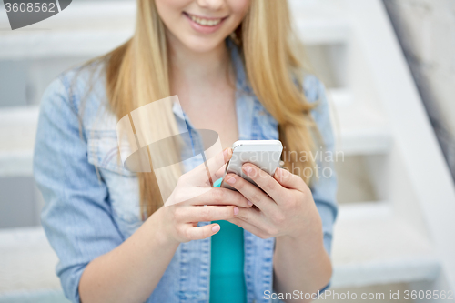 Image of close up of female hands with smartphone