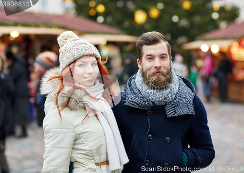 Image of happy couple walking in old town