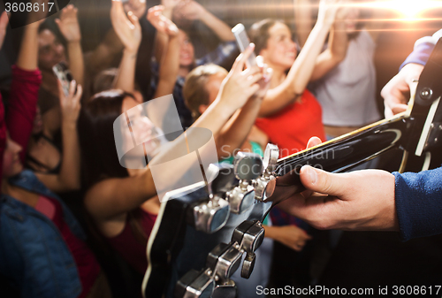 Image of close up of people at music concert in night club