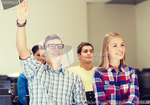 Image of group of smiling students in lecture hall