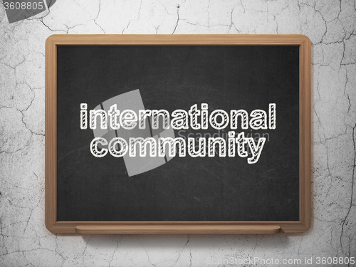 Image of Political concept: International Community on chalkboard background
