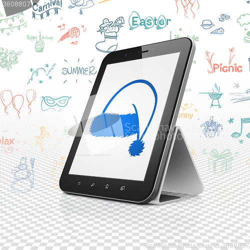 Image of Entertainment, concept: Tablet Computer with Christmas Hat on display
