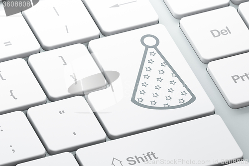 Image of Holiday concept: Party Hat on computer keyboard background
