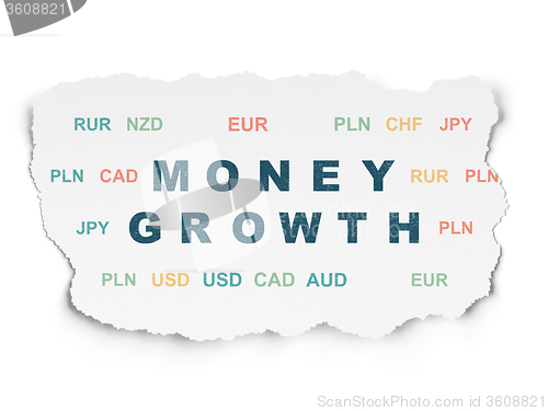 Image of Currency concept: Money Growth on Torn Paper background