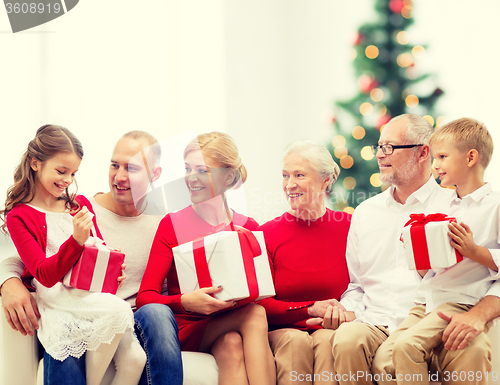 Image of smiling family with gifts