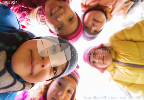 Image of group of happy children faces in circle