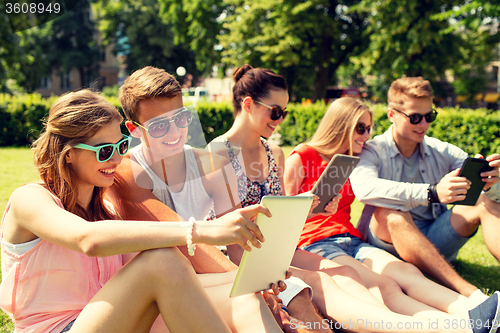 Image of smiling friends with tablet pc making selfie