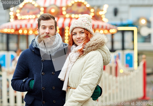 Image of happy couple walking in old town