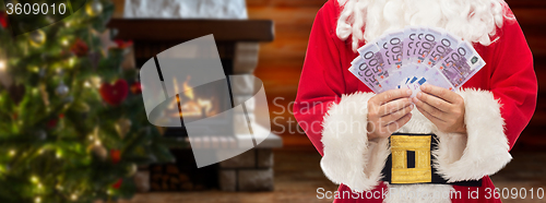 Image of close up of santa claus with euro money