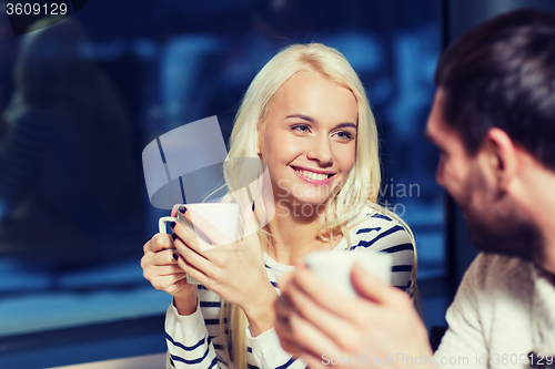 Image of happy couple meeting and drinking tea or coffee