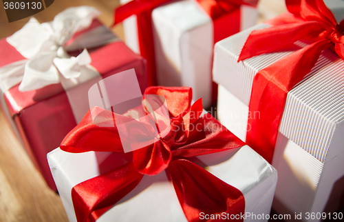 Image of close up of gift boxes on wooden floor