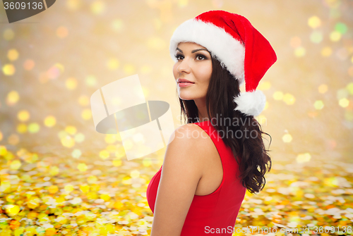 Image of beautiful sexy woman in santa hat and red dress