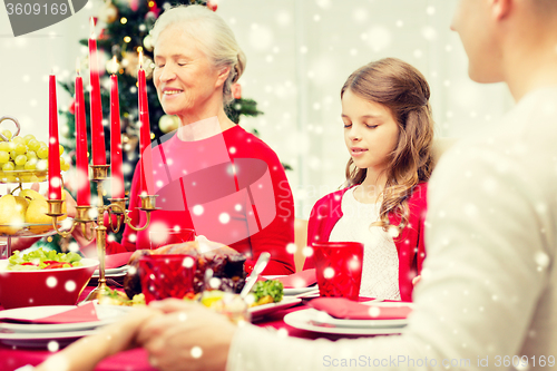 Image of smiling family having holiday dinner at home