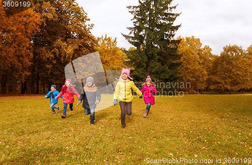 Image of group of happy little kids running outdoors