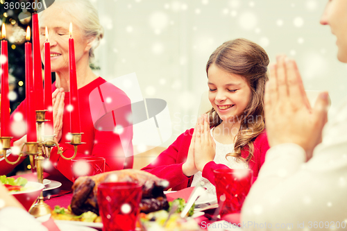 Image of smiling family having holiday dinner at home