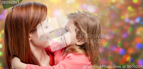 Image of happy mother and little daughter hugging