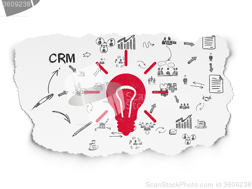 Image of Finance concept: Light Bulb on Torn Paper background