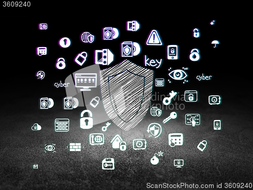 Image of Security concept: Shield in grunge dark room