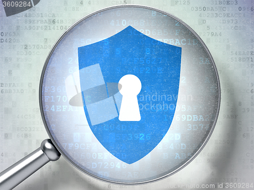 Image of Protection concept: Shield With Keyhole with optical glass on digital background