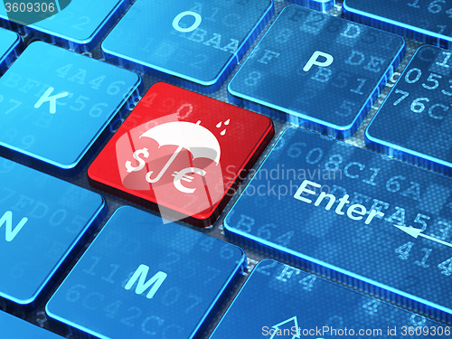 Image of Safety concept: Money And Umbrella on computer keyboard background