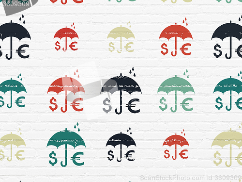 Image of Protection concept: Money And Umbrella icons on wall background