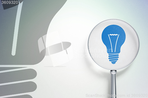 Image of Business concept:  Light Bulb with optical glass on digital background