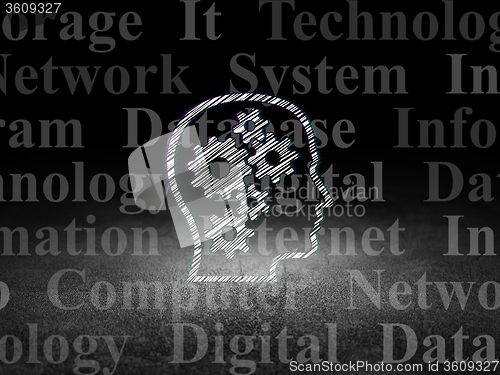 Image of Information concept: Head With Gears in grunge dark room