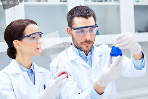 Image of young scientists making test or research in lab