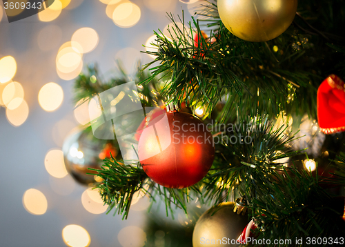 Image of close up of christmas tree decorated with balls