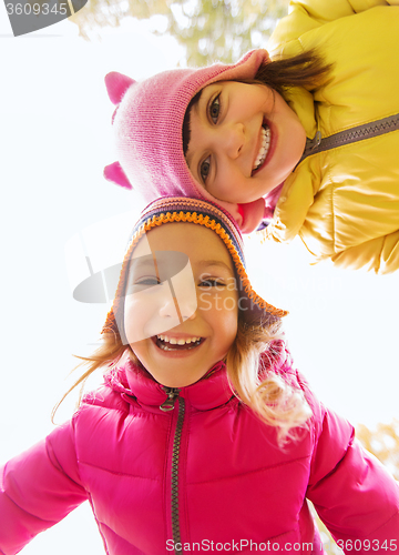 Image of happy girls faces outdoors