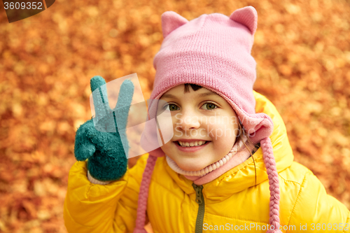 Image of happy little girl in autumn park