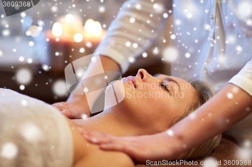 Image of close up of woman lying and having massage in spa