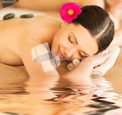 Image of woman in spa with hot stones