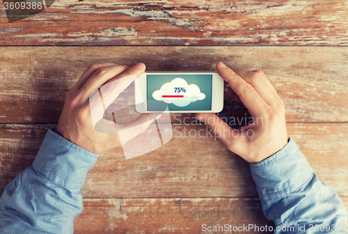 Image of close up of hands with smartphone cloud computing