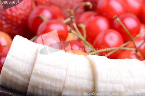 Image of Composition with fruits cherry bananas strawberry