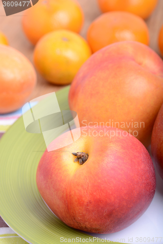 Image of many different fruits for the health of the entire family, peach, mandarin, apple