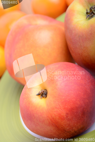 Image of many different fruits for the health of the entire family, peach, mandarin, apple