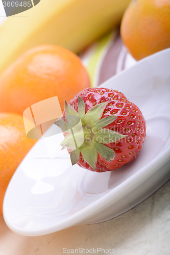 Image of Fresh colorful fruits composition mandarin, strawberry, peach, bananas and orange