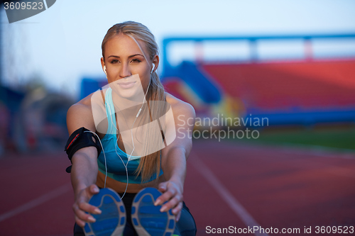 Image of sporty woman on athletic race track