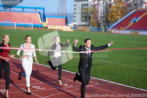 Image of business people running on racing track