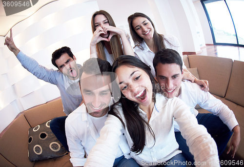 Image of group of friends taking selfie