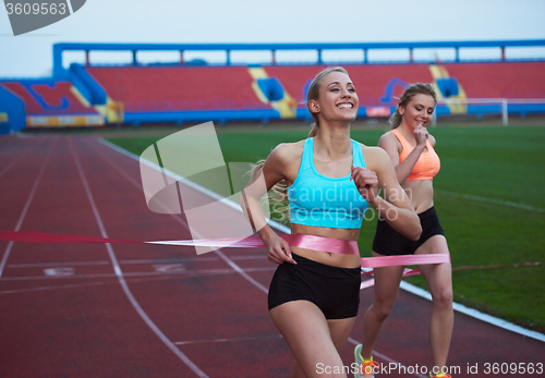 Image of Female Runners Finishing Race Together