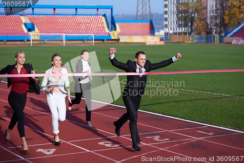 Image of business people running on racing track