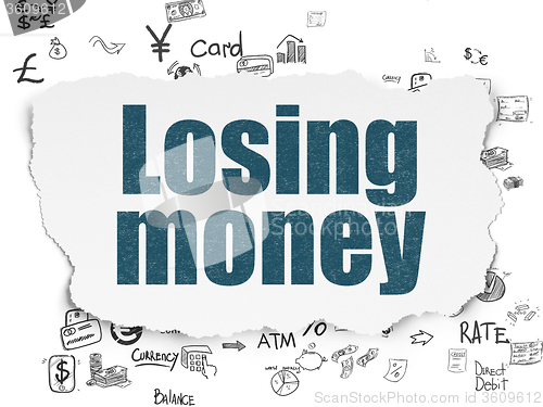 Image of Currency concept: Losing Money on Torn Paper background