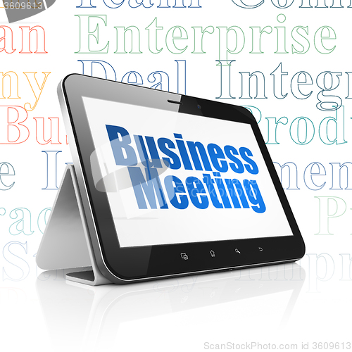 Image of Finance concept: Tablet Computer with Business Meeting on display