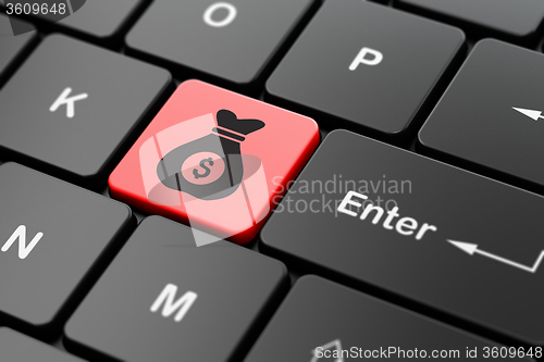 Image of Finance concept: Money Bag on computer keyboard background