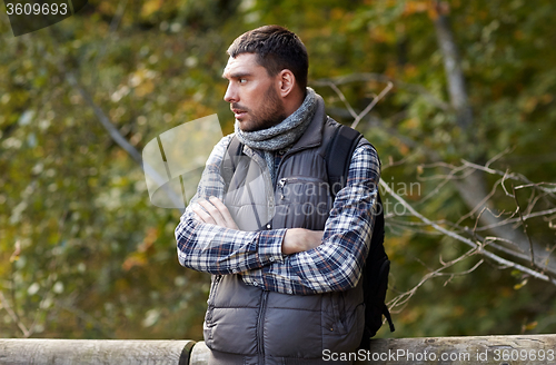 Image of man with backpack outdoors