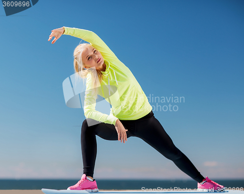Image of woman doing sports outdoors